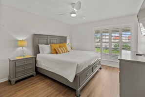 Primary Bedroom With Large Window, Natural Lighting & Flat Screen TV