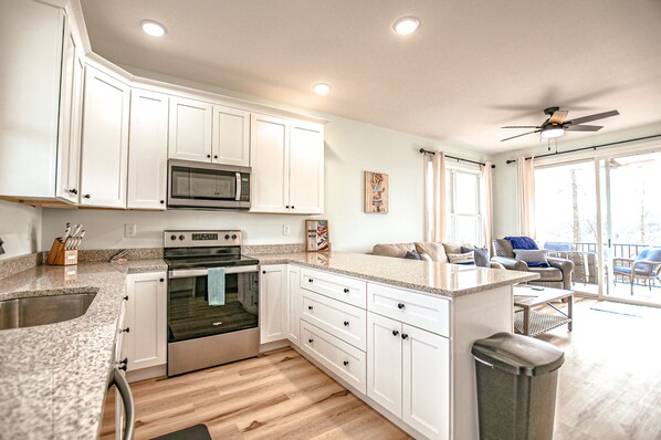 Open kitchen to living room and deck