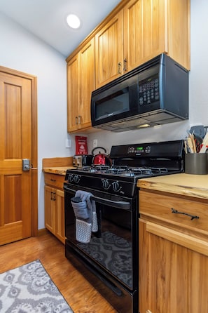 Gas (propane) stovetop, electric oven and microwave