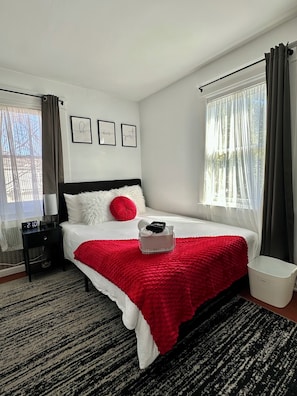 Chic, bright bedroom with art & TV - perfect for relax & entertainment! #CozyUp