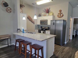 Kitchen bar has 3 bar stools