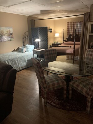 Great room!  Queen bed with privacy curtain.
Half bed also in great room.