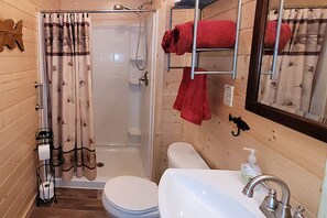 Bath with shower. 