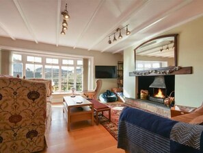 Cosy sitting area with new multi-fuel stove.