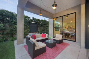 Large sliding door off from the patio with comfortable seating.