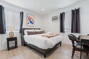 Bedroom 2 features a queen bed.