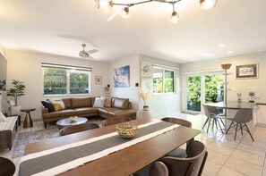 Open and airy living and dining space, complete with plenty of inviting seating options for ultimate comfort.