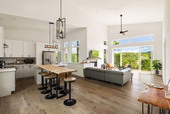 From stove to sofa, this open space flows with comfort and style. Go ahead, spread out.