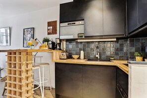 The kitchen is fully equipped to prepare a simple meal