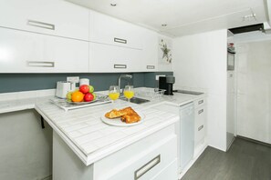 The kitchen is fully equipped to prepare a simple meal