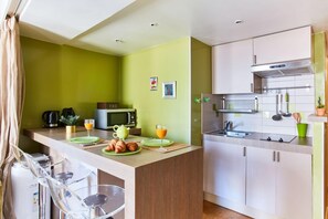 The kitchen is fully equipped to prepare a simple meal