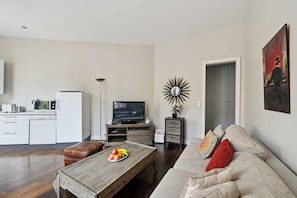 The open-plan living area and the kitchen