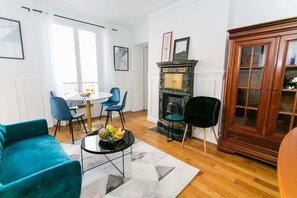 The living and dining area overlooking Rue de Sevres