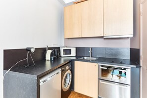 The kitchen is fully equipped to prepare a simple meal