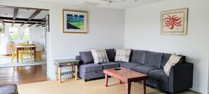 kitchen sitting area with large, smart TV