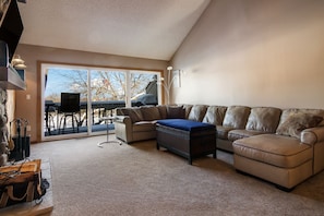 Spacious Living Room with Wood Fireplace.