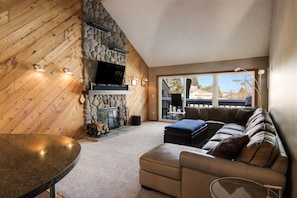 Spacious Living Room with Wood Fireplace.