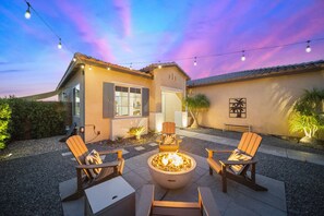 Relax around the fire. Take in the beautiful desert views across the street.