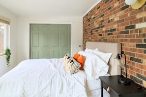 Bedroom 1: The room's decor balances chic minimalism with a touch of urban flair.