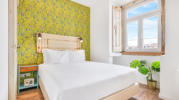 A comfortable bedroom with a city view, a TV, and a safe lock to keep your items safe. #comfort #cityview #safelock #portugal #pt #lisbon