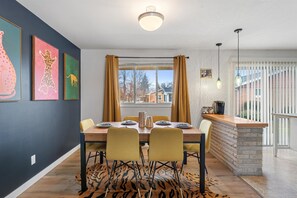 Dining area with 6 plush seats and table setup