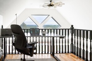 Internal balcony & office (remote workspace) with adjustable standing desk.