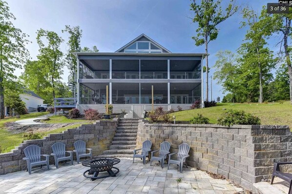 Grand lake front home!  Huge screened in porches and water front fire pit