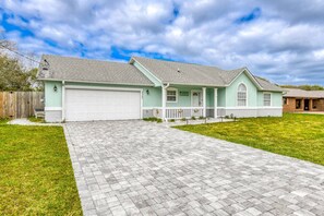 There is plenty of parking in the driveway, including a 2 car garage.