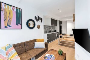 The living area with a 3-seater sofa bed that folds out to a queen.