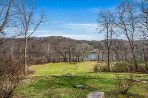The large back yard that leads to the river bank.