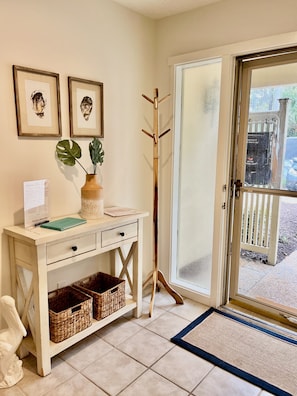 Front entry door and coat rack from the parking lot 