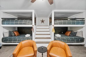 The bunkroom with 4 queen beds.