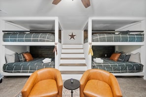 The bunkroom with 4 queen beds.