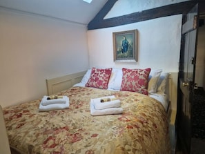 The Living Area: cosy up in the fresh crisp linens in the comfortable double bed.