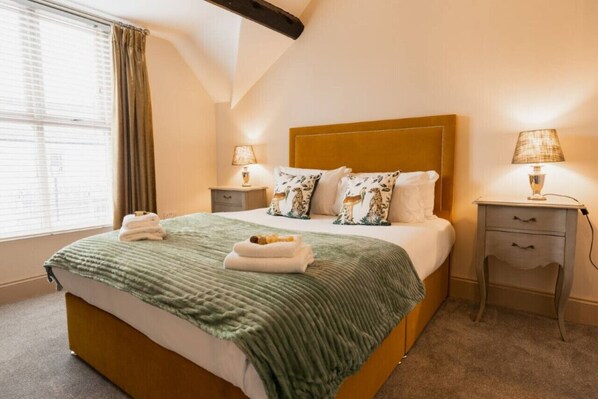 Bedroom 1: sink into the soft linens on the king size bed in this lovely bedroom.