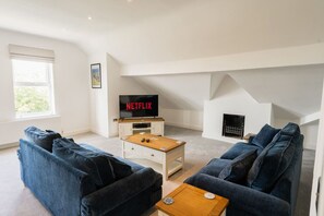 Open Plan Living/Dining Area: the generous open plan dining/living area is perfect for relaxing after a day of exploring the local area, featuring a smart TV for your entertainment.