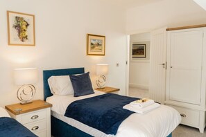 Bedroom 1: The first bedroom comes complete with ample storage, for a comfortable stay.