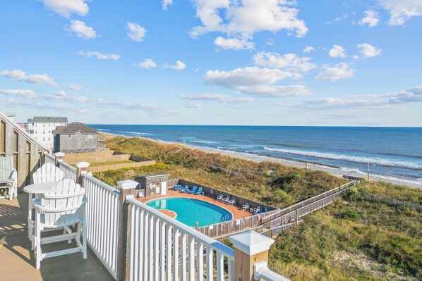 Venture onto the private balcony overlooking the ocean and many resort amenities.