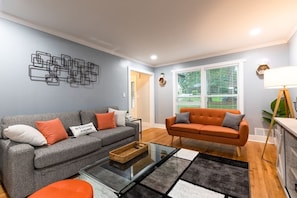 Would you believe that grey couch doubles as a sleeper sofa w/ a Queen sized memory foam mattress inside of it's tummy.... that could comfortably sleep two? So technically this "Jazzy living room" now doubles as a "Jazzy bedroom"
c: LOL!