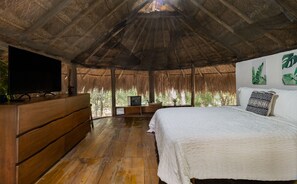 Your jungle bedroom beneath the palapa fully equipped with queen size bed & tv