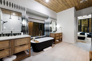 Soak in this bathtub in the OVERSIZED Master bathroom - while looking out into the windows