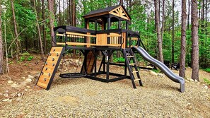 Bring the kids if you please - they will love the outdoor playset surrounded by string lights