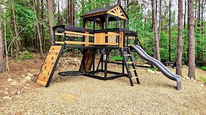 Bring the kids if you please - they will love the outdoor playset surrounded by string lights