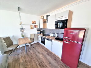 modern kitchen including a cozy dining area