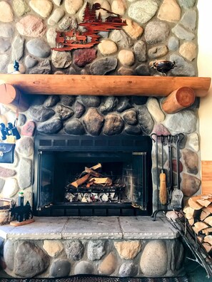 Wood burning fireplace in living room