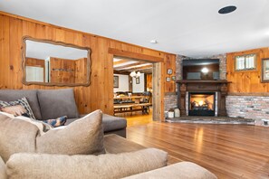 Living room with fireplace and 55" smart tv