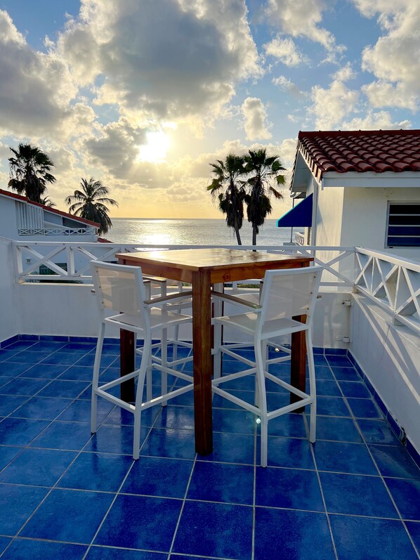 Upper deck with table for 4 overlooking the Caribbean Sea