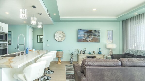 Large open Living room with 180 degree views of the ocean with a pull out queen sofa sleeper.