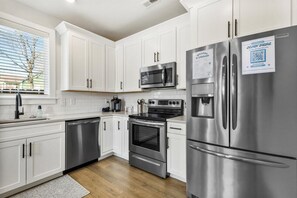 Modern Kitchen Stocked w/ Supplies