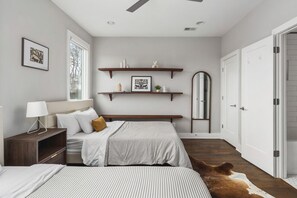 Bedroom #2 with two queen beds, a closet, and full-length mirror, attached to the jack-and-jill bathroom.